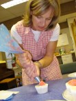 Carol decorating her cupcake