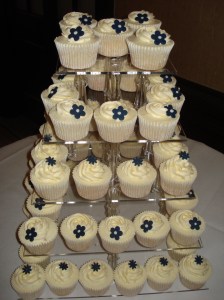Ivory and navy wedding cupcakes on 5 tiered stand