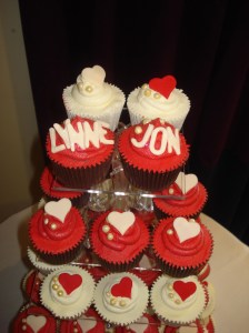The top tier of wedding cupcakes
