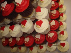 7 tiers of red and ivory cupcakes
