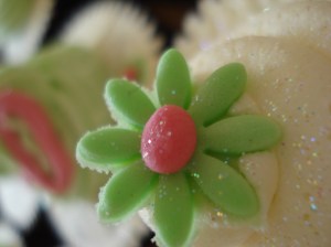 Green flower on white swirl with chocolate sponge