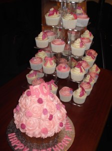 Giant cupcake and tower of rose themed girly cupcakes